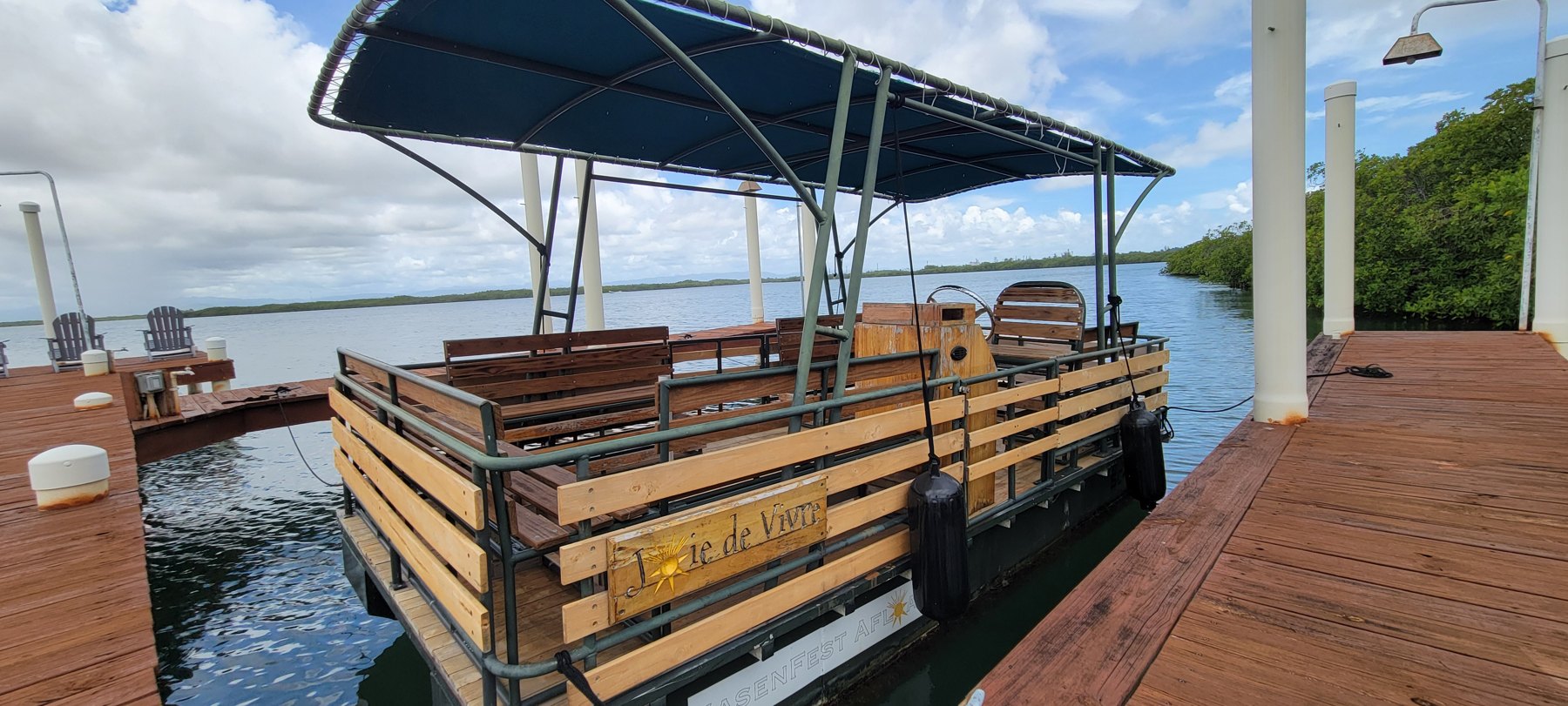 Private dock reaching across the water to the community
